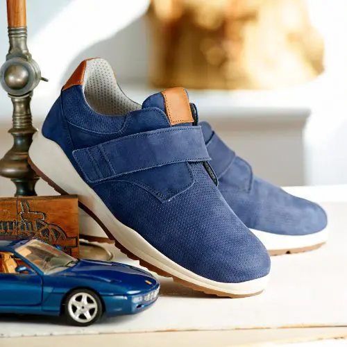 A pair of blue strap shoes on a table